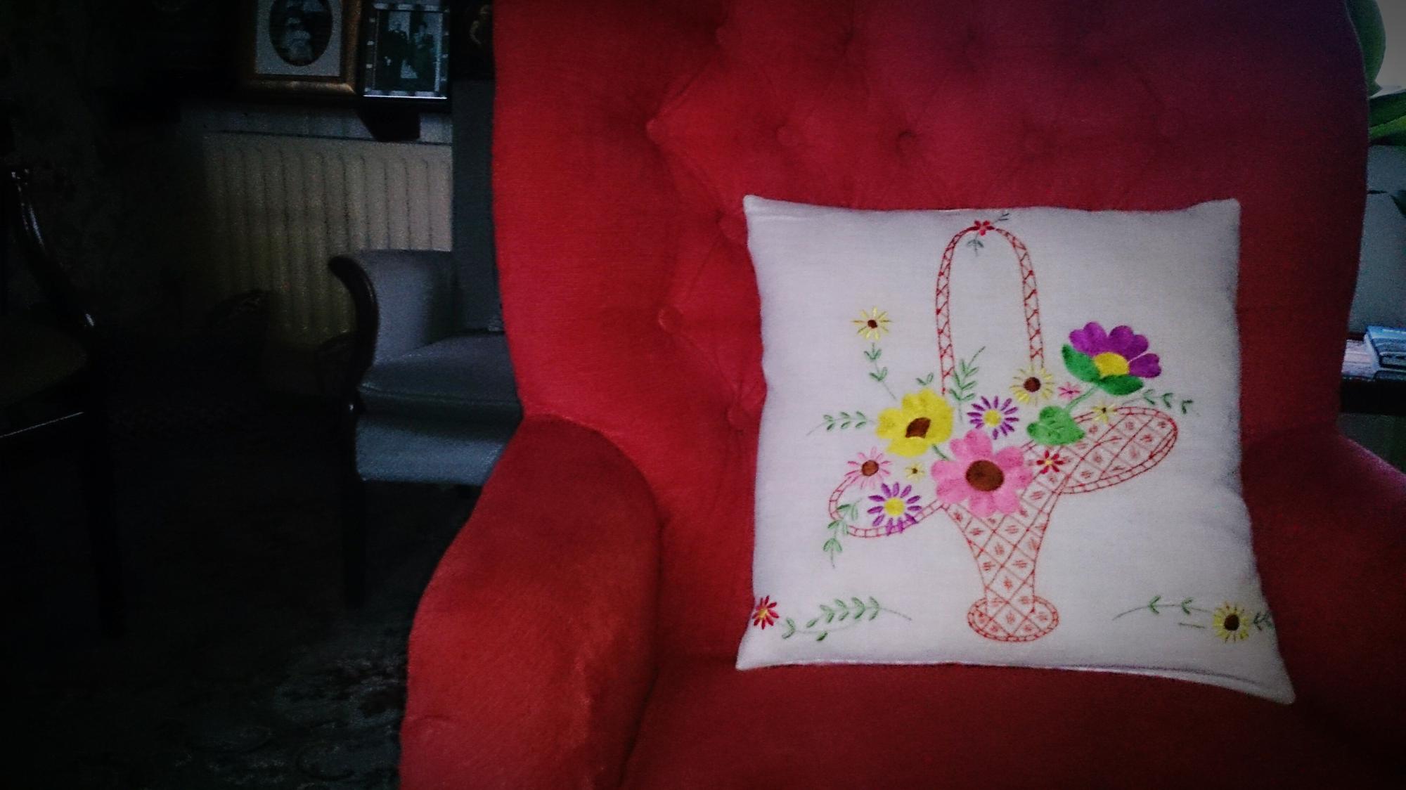 Finished decorative pillow with signature stitch